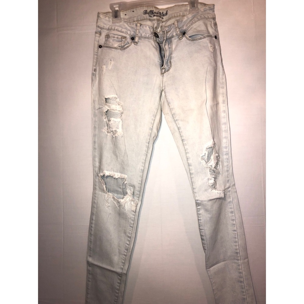 Light wash distressed bullhead skinny jeans